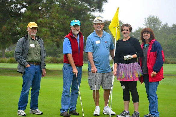 Alan Scott (center) and fellow Mid-Valley Literacy Center staff members having a blast during a company fundraiser.
