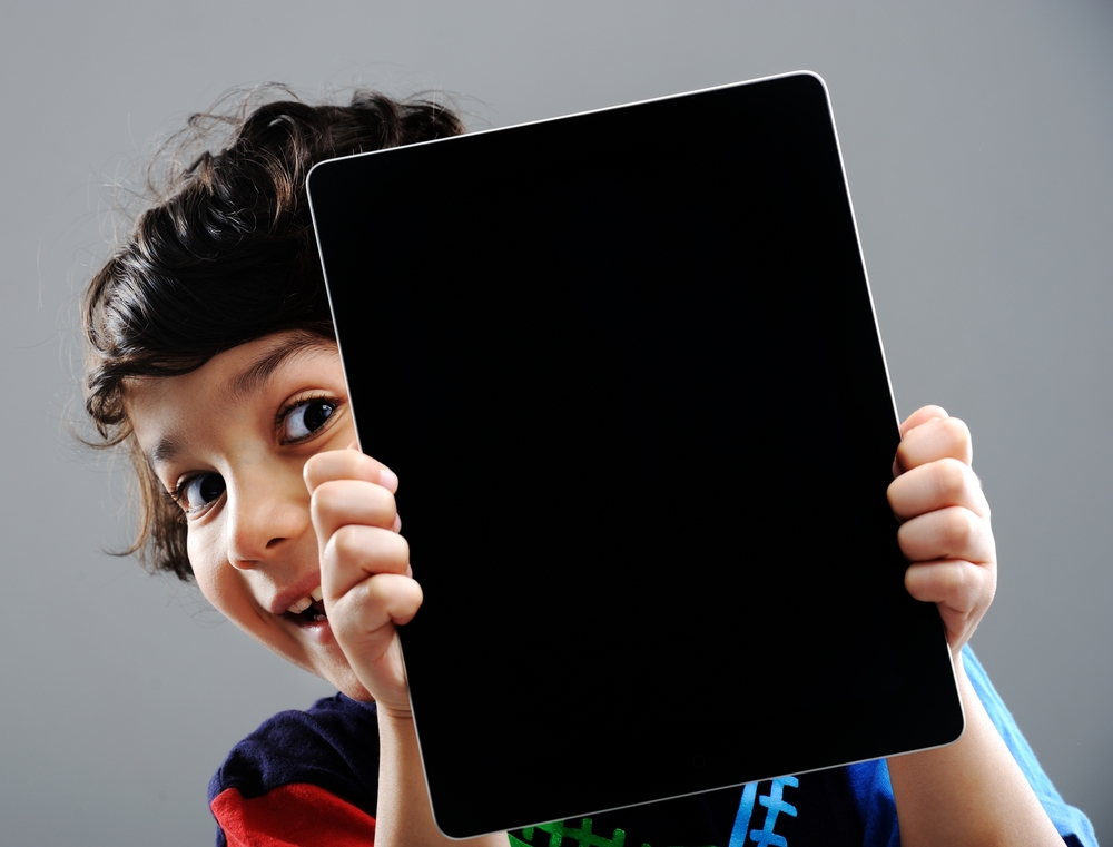 Cute kid with Tablet